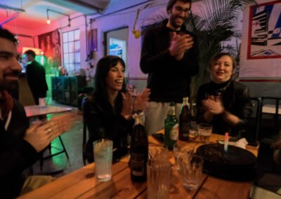 A group of happy travellers and locals enjoying their time in a local bar