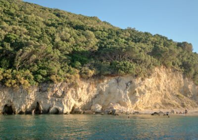 Golden sun rays on the rocks and greenery of Marathonisi "Turtle island" in Zakynthos.