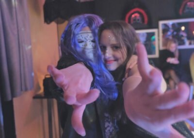 enchanting calling from two girls, one of them is wearing a mask