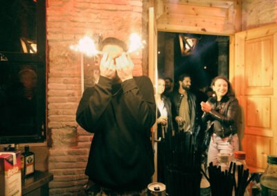 Party time in Zakynthos island. A group of people holding champagne sparklers while they enter the door of the nightclub in Zakynthos
