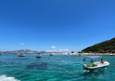 Small boats cruising around marathonisi Island and this picture is taken from the boat