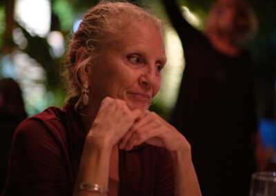 a Portrait of a beautiful older lady in this Sunset to nighlife experience in a Zakynthos island Bar enjoying her drink