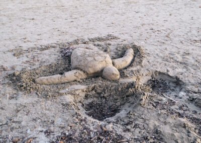 A sand creation of a sea turle Caretta Caretta in Kalamaki Beach in Zakynthos