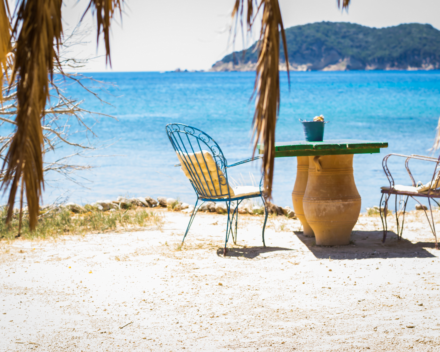 A table with chairs on a seaview restaurant in Dafni Beach Zakynthos