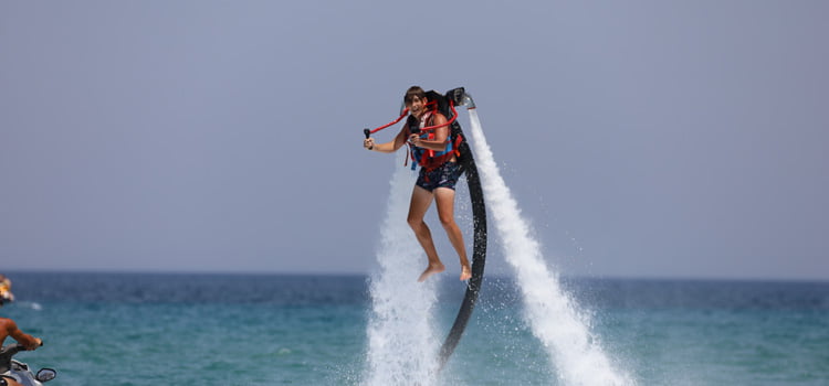 Jet Set Go! A man "flying" with a water jet pack on his back!