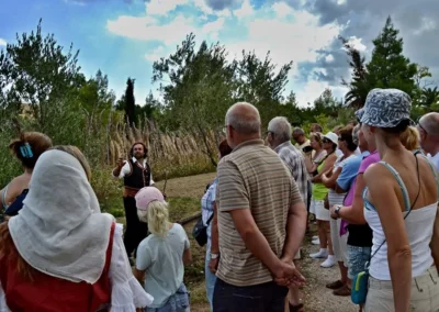 A guide talking to a group of people inside Therianos Organic Farm on this Private Tour in Zakynthos