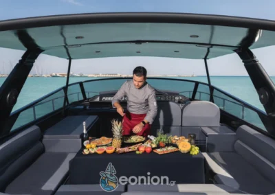 Chef preparing dishes for the guests outside of Pershing 40 - eonion Yachts