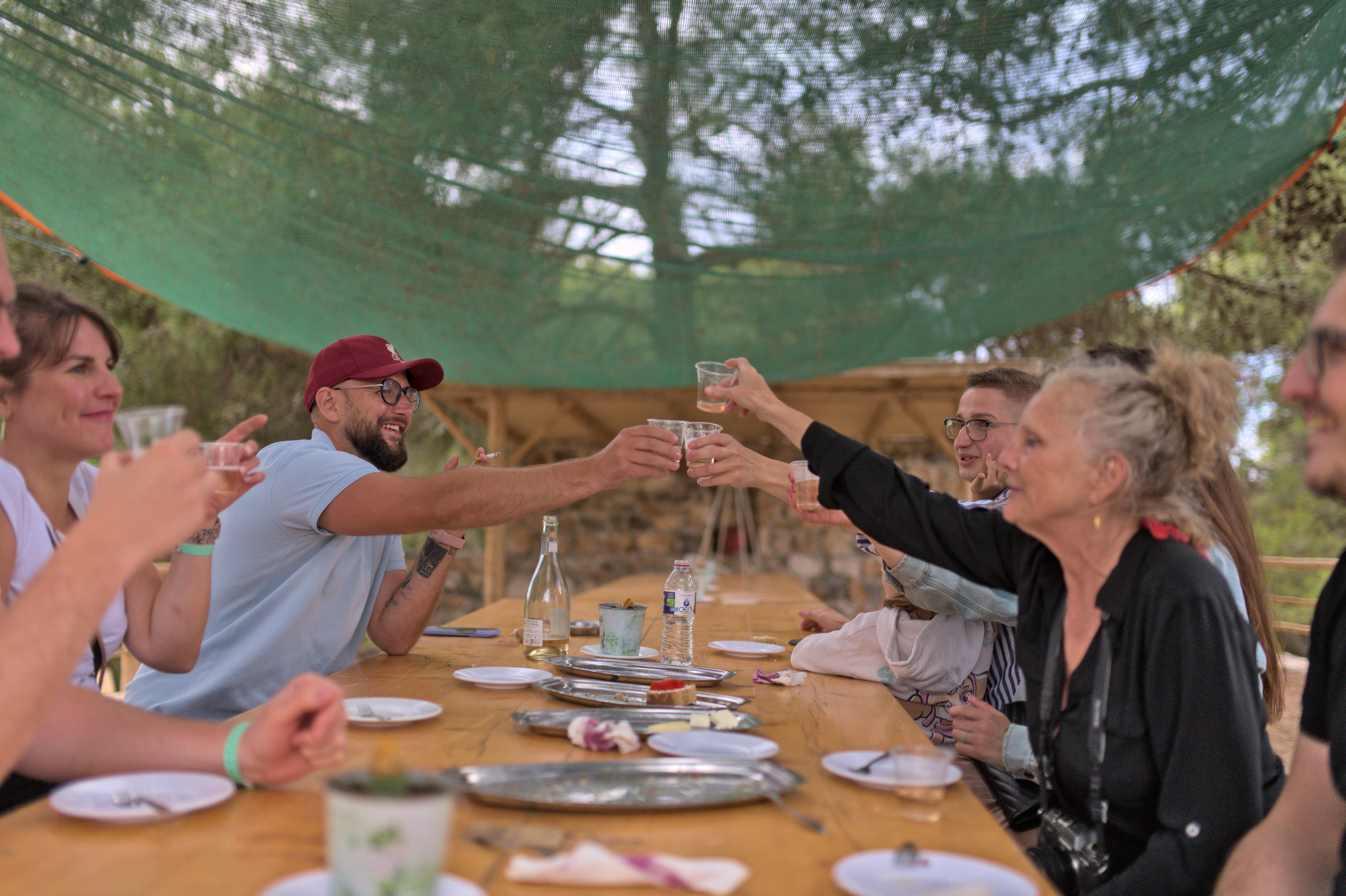 Travelers enjoying a winetasting experience in a vineyard in Zakynthos